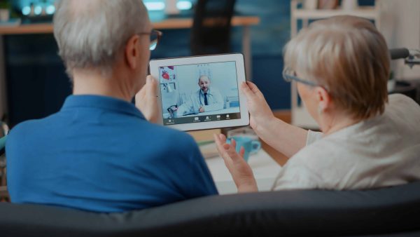 senior-couple-attending-online-meeting-with-doctor-digital-tablet-doing-remote-consultation-home-elder-people-using-videoconference-call-modern-gadget-internet-telemedicine(1)